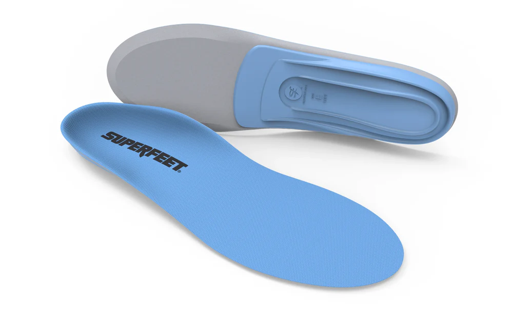 Blue Superfeet insole with a gray underside, curved shape for arch support.