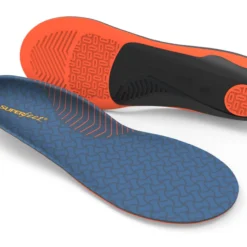 Blue Superfeet insole with orange underside, showing tread pattern for cushioning and arch support.