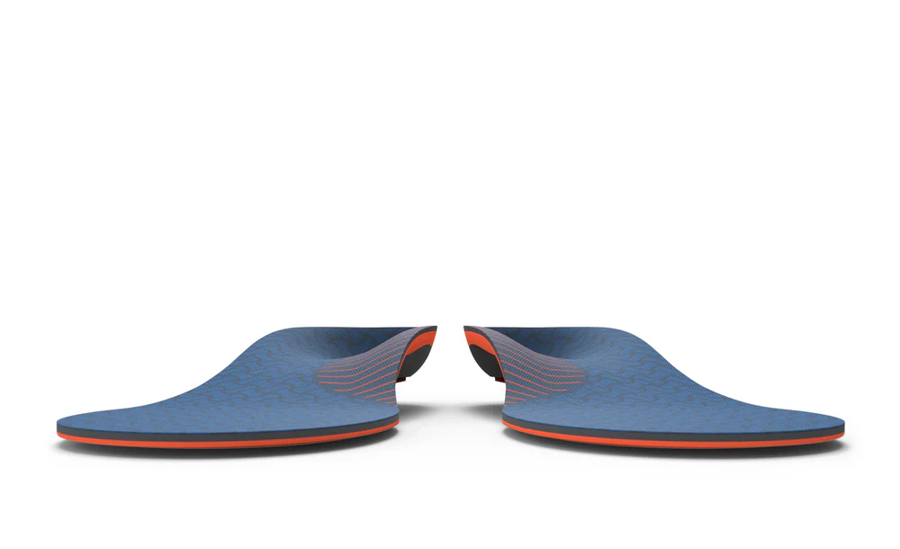 View7_Work_Cushion_2731x1667_13e2809a-f360-4f74-9e88-752959bb2907 - Horizon Industries Pair of blue slip-on shoes facing each other with orange trim along the soles, on a white background.